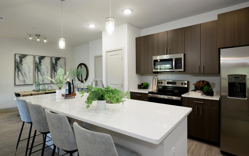 a kitchen with a dining table and chairs